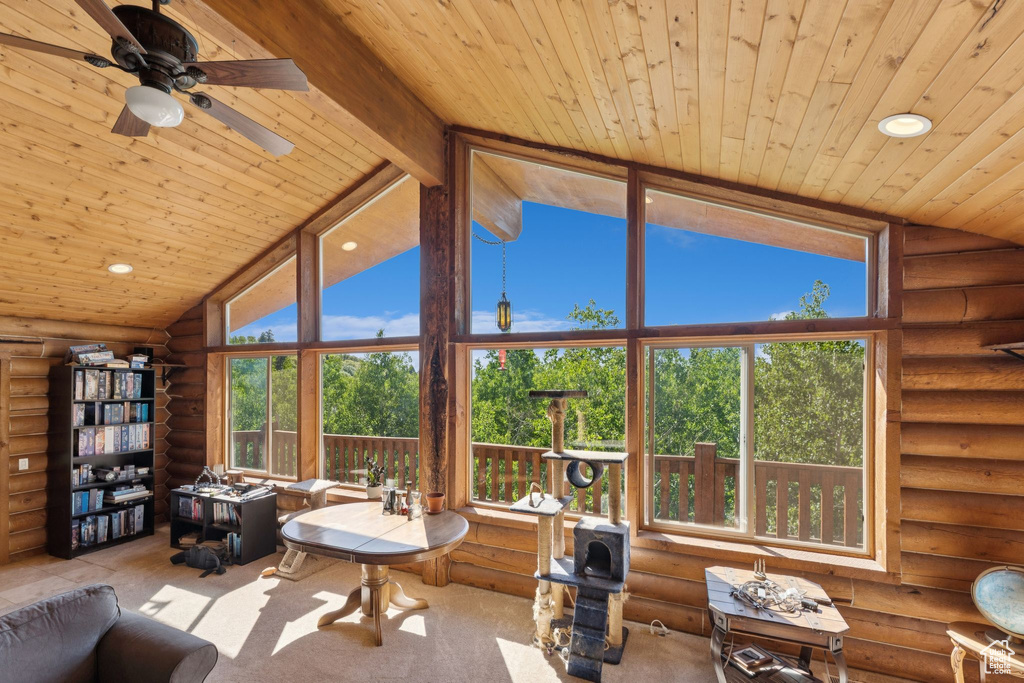 Living area with log walls, wooden ceiling, ceiling fan, and recessed lighting