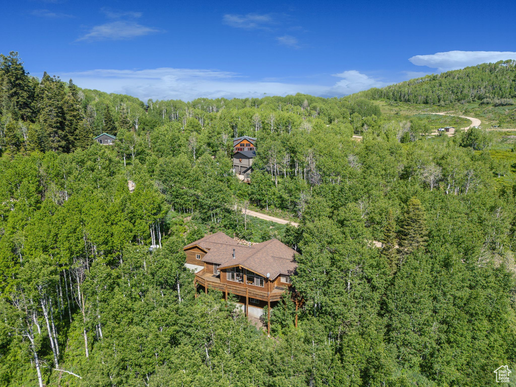 View from above of property featuring a forest
