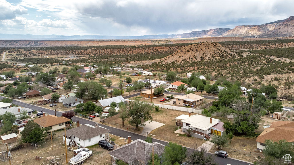 Aerial view of residential area featuring a mountainous background