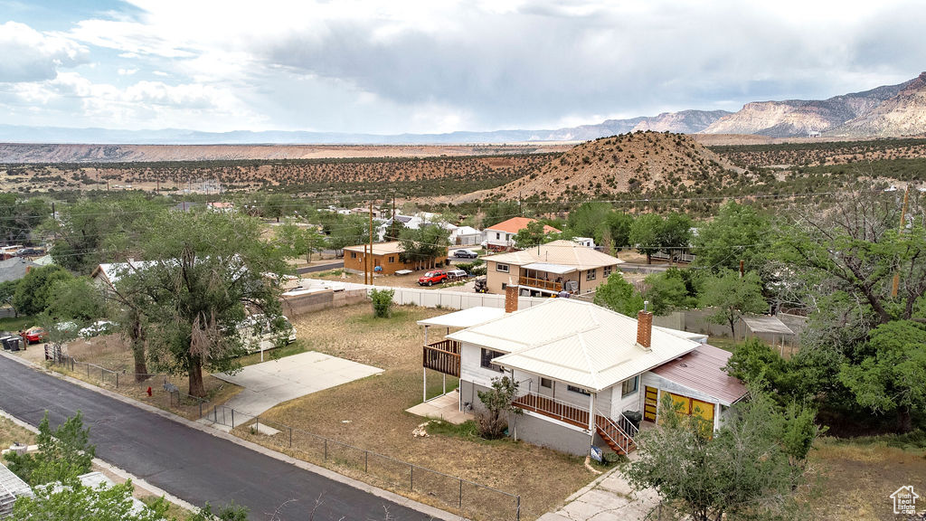 View of subject property featuring mountains