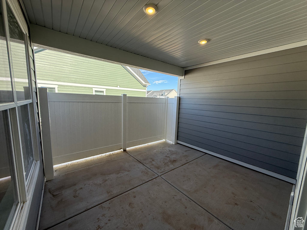 View of patio featuring fence