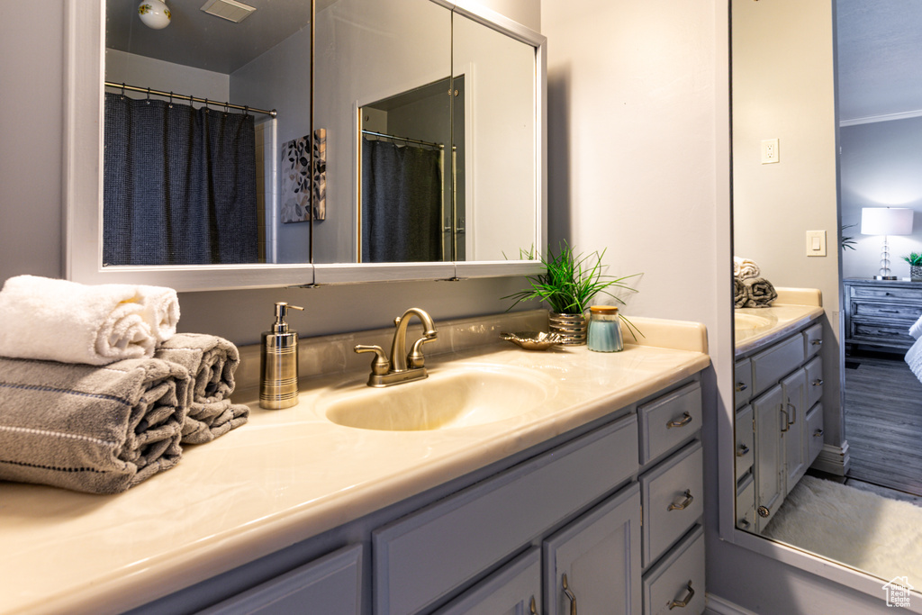Ensuite bathroom featuring vanity