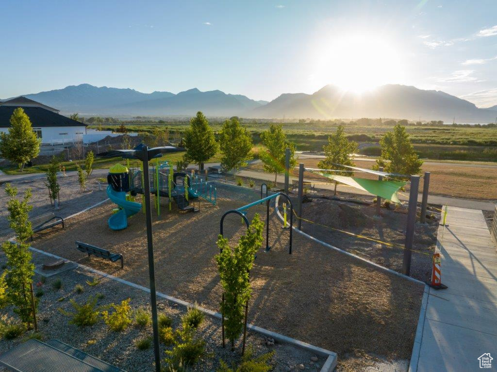Community playground featuring a mountain view