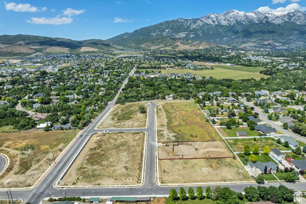 Aerial overview of property\'s location with a mountainous background