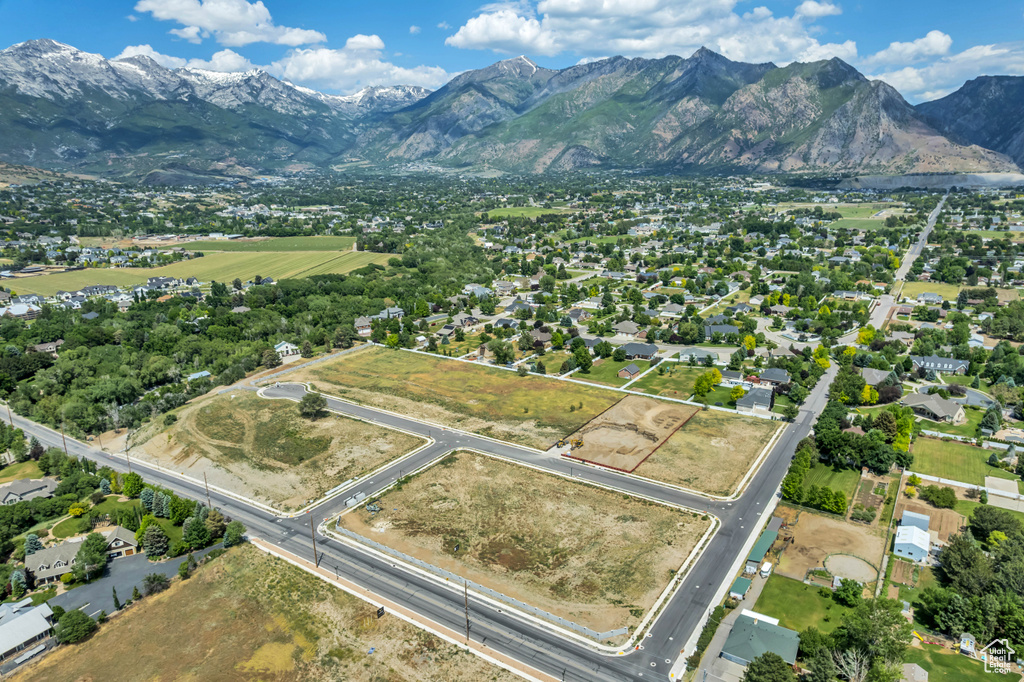 Aerial overview of property's location with a mountainous background
