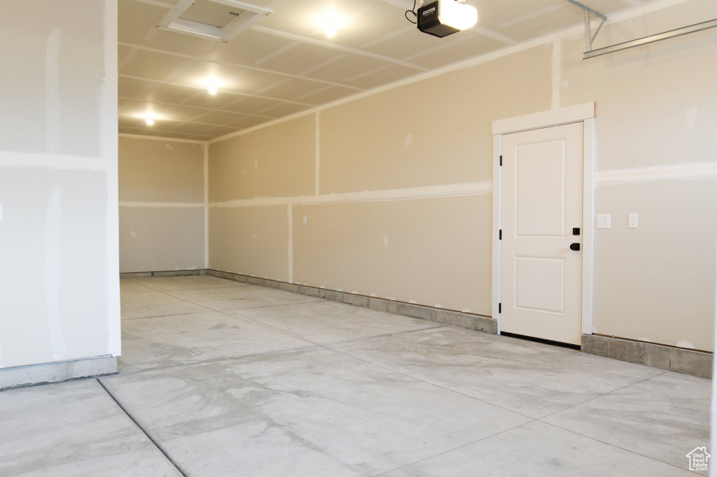Garage featuring a garage door opener