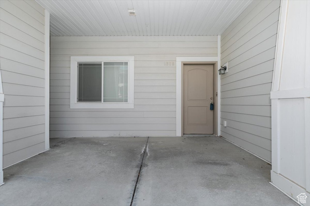 Entrance to property featuring a patio