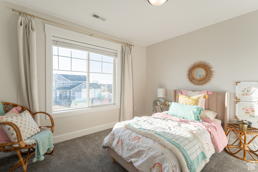 Bedroom with multiple windows, carpet flooring, visible vents, and baseboards