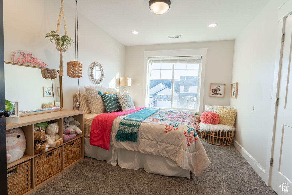 Carpeted bedroom featuring recessed lighting, visible vents, and baseboards