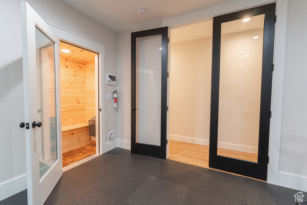 Interior space featuring french doors, recessed lighting, and baseboards