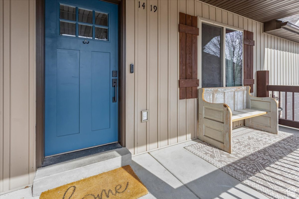 Entrance to property with board and batten siding