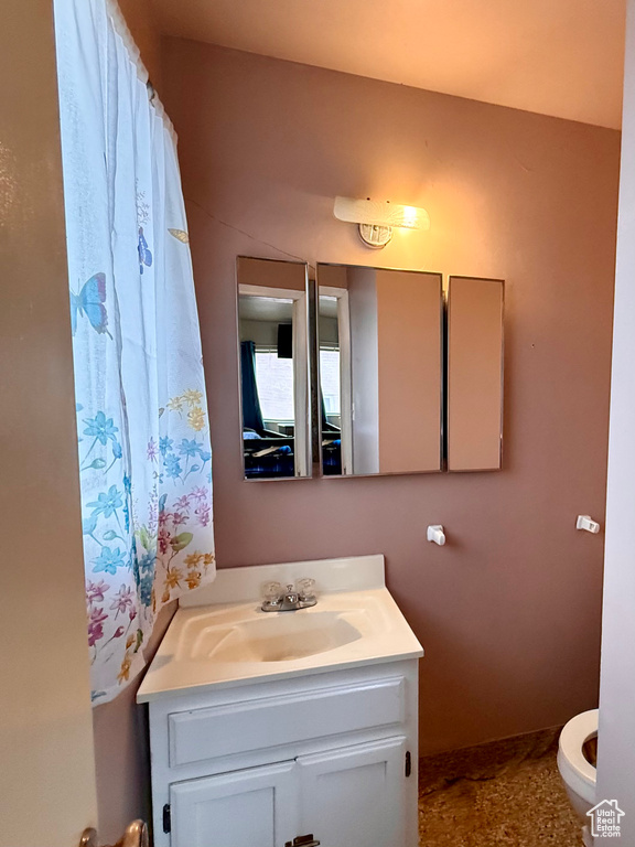 Bathroom with toilet and vanity