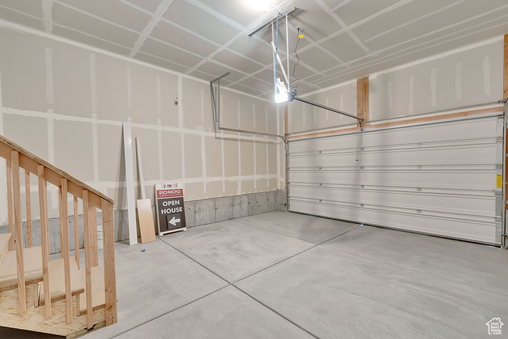 Garage featuring a garage door opener