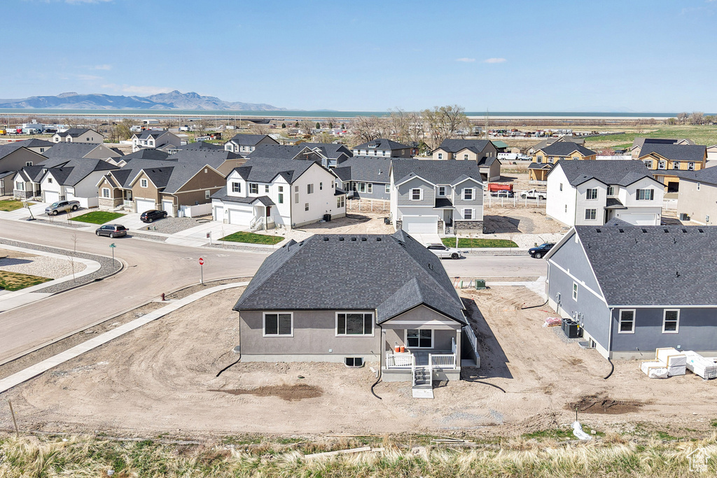 Drone / aerial view featuring a mountain view and a residential view
