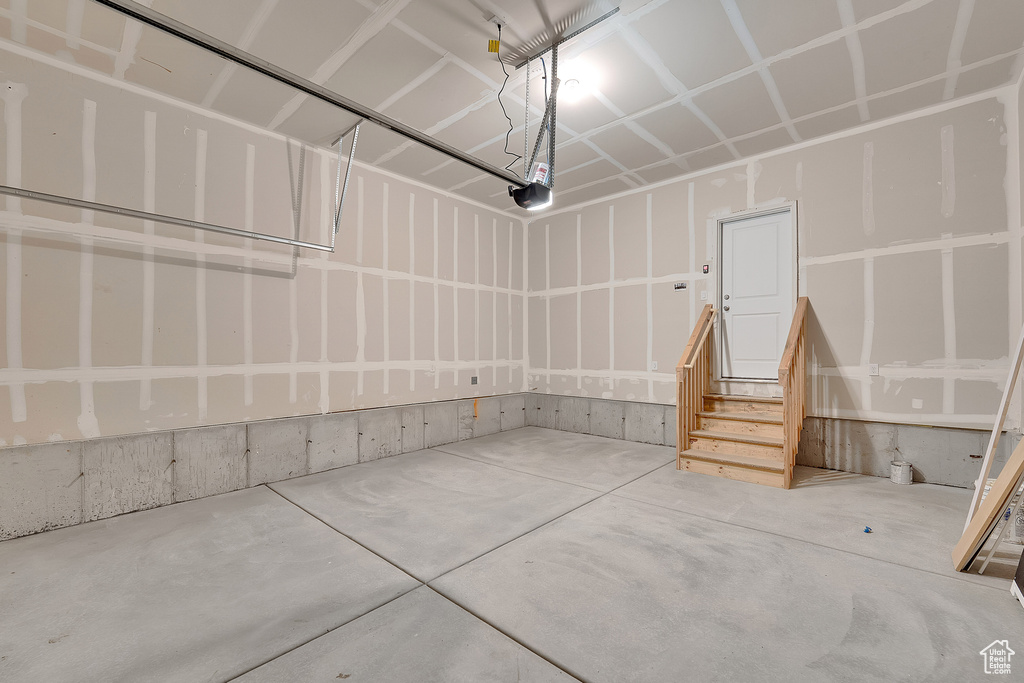 Garage featuring a garage door opener
