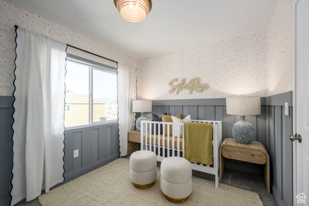 Bedroom featuring carpet floors and wallpapered walls