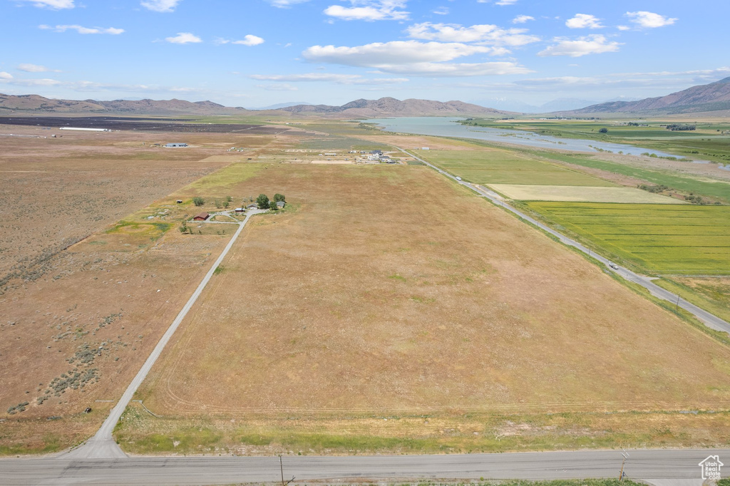 Aerial view of sparsely populated area with a mountain backdrop