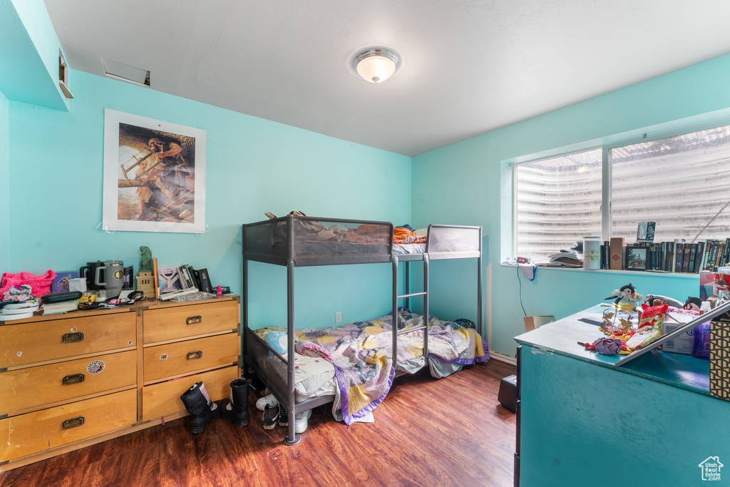 Bedroom featuring wood finished floors