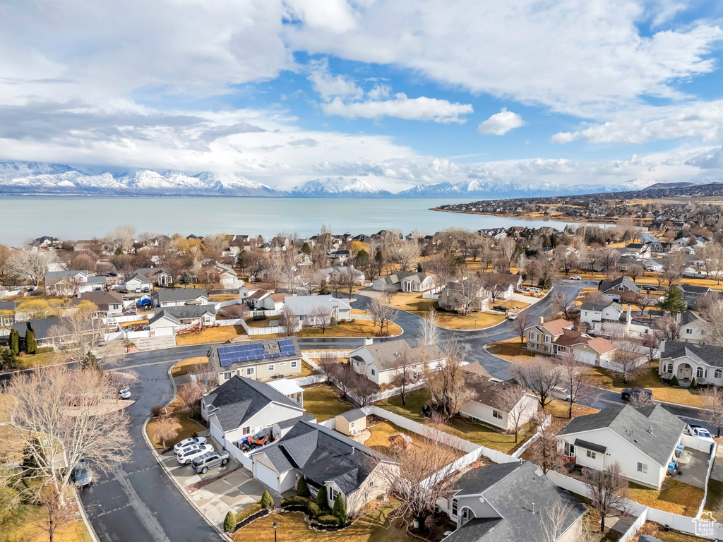 Drone / aerial view featuring a water view and a residential view