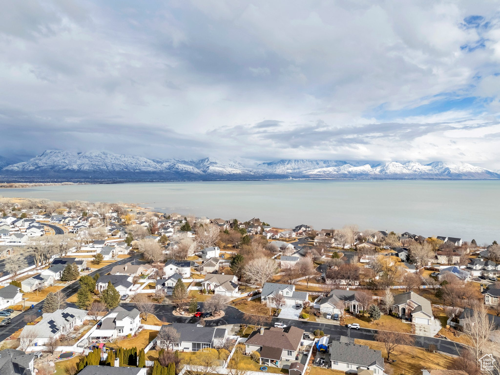 Birds eye view of property featuring a residential view and a water and mountain view