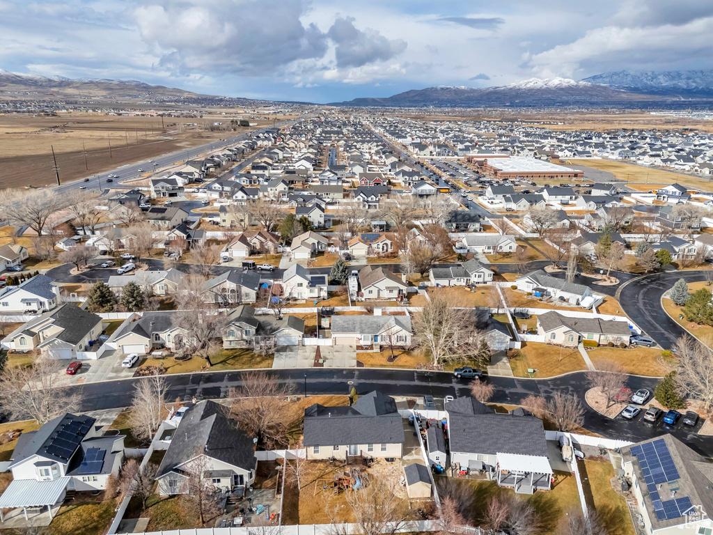 Birds eye view of property with a mountain view and a residential view