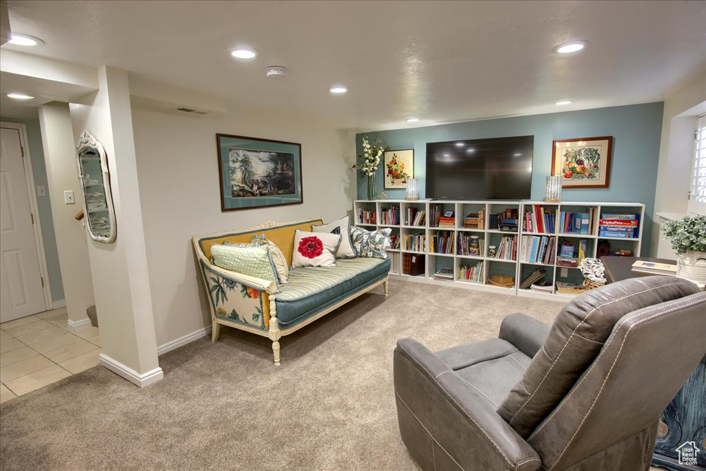 Sitting room featuring baseboards, carpet, tile patterned flooring, and recessed lighting