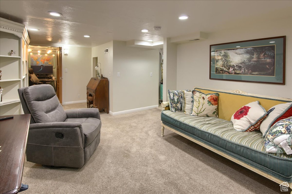 Living area featuring carpet floors, recessed lighting, and baseboards