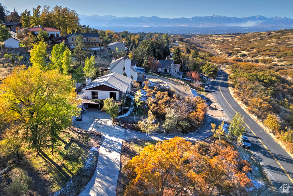 Birds eye view of property with a residential view and a mountain view