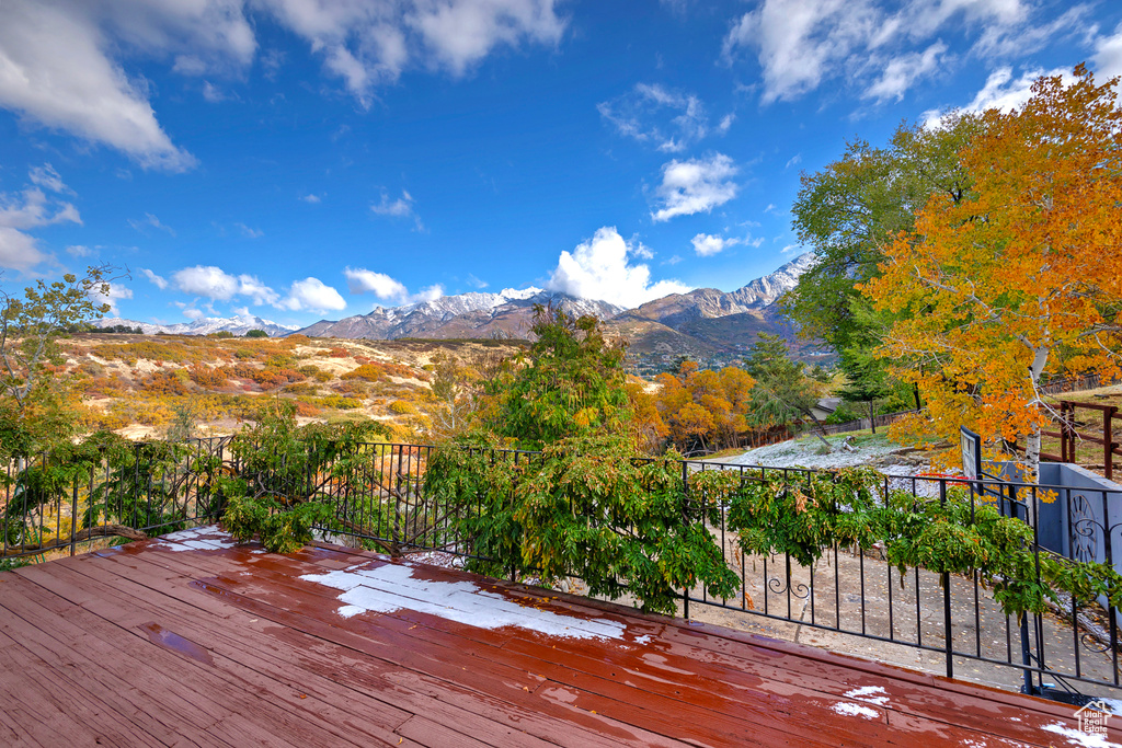 Wooden deck featuring a mountain view