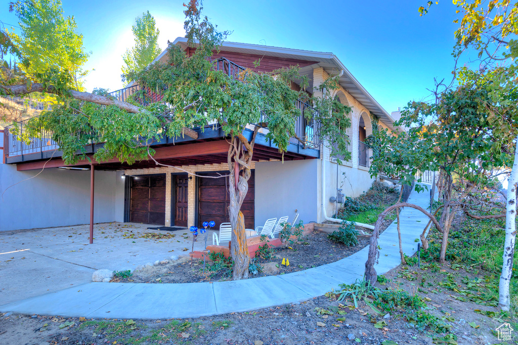 View of side of home featuring a patio