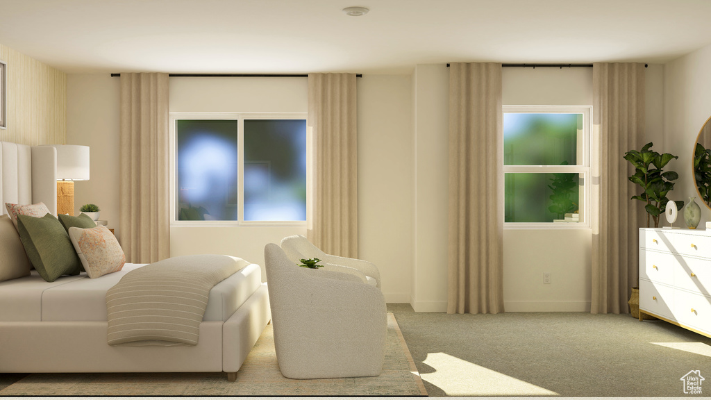 Carpeted bedroom featuring baseboards