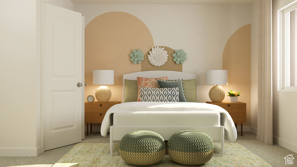 Carpeted bedroom featuring baseboards and arched walkways