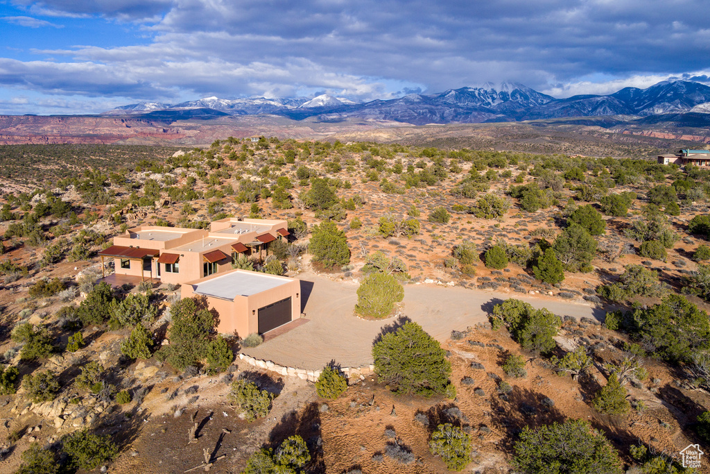 Birds eye view of property with a mountain view