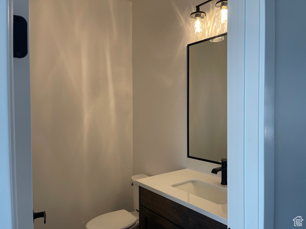 Bathroom featuring vanity and toilet