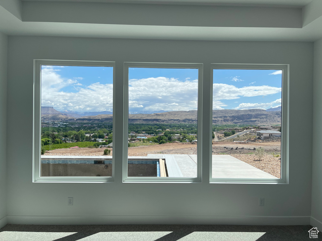 Detailed view of a mountain view, carpet, and baseboards