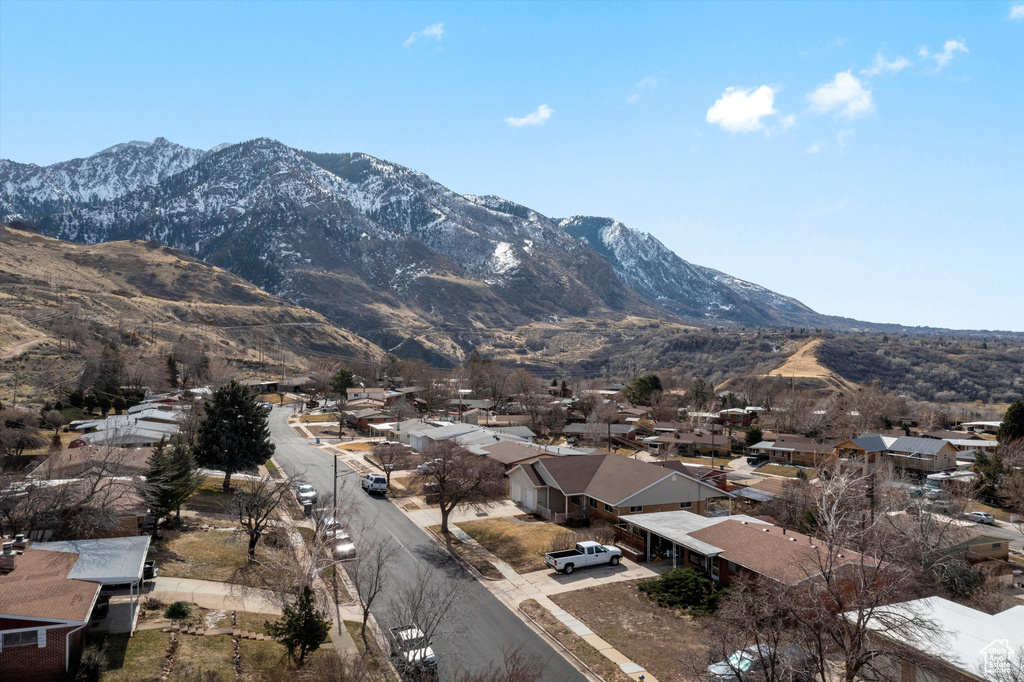 Property view of mountains with a residential view