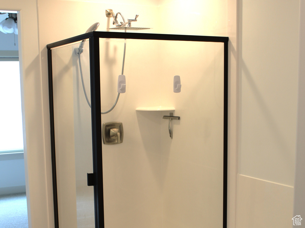 Full bath with wood finished floors, a stall shower, and a garden tub