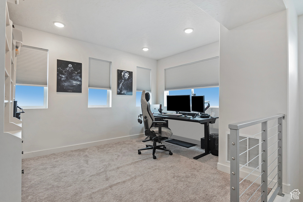 Carpeted home office featuring baseboards and recessed lighting