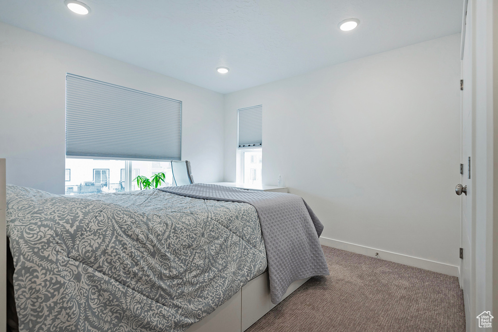 Bedroom featuring recessed lighting, carpet, and baseboards