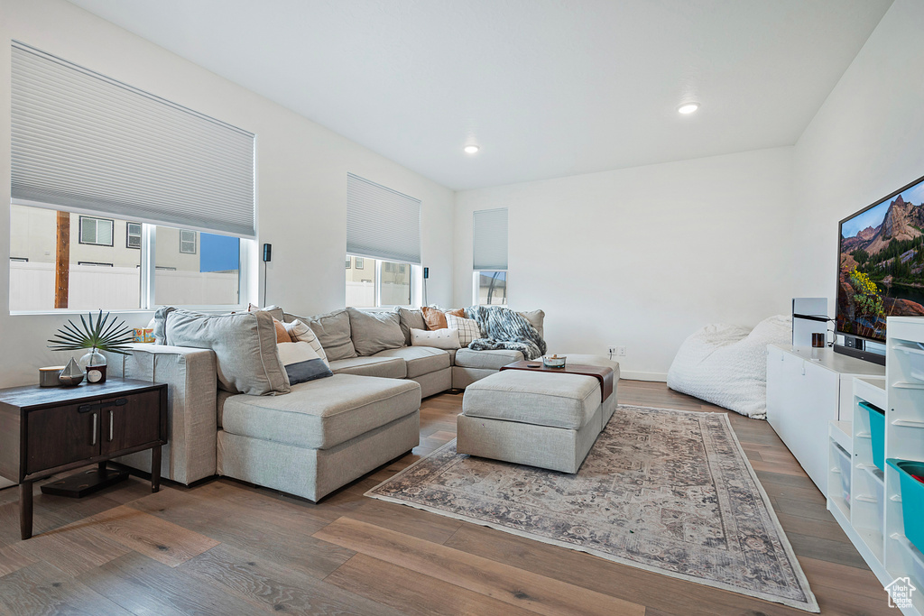 Living area with recessed lighting and wood finished floors