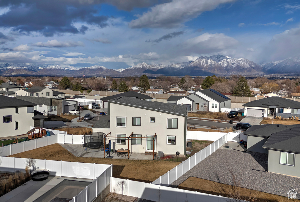 Property view of mountains with a residential view