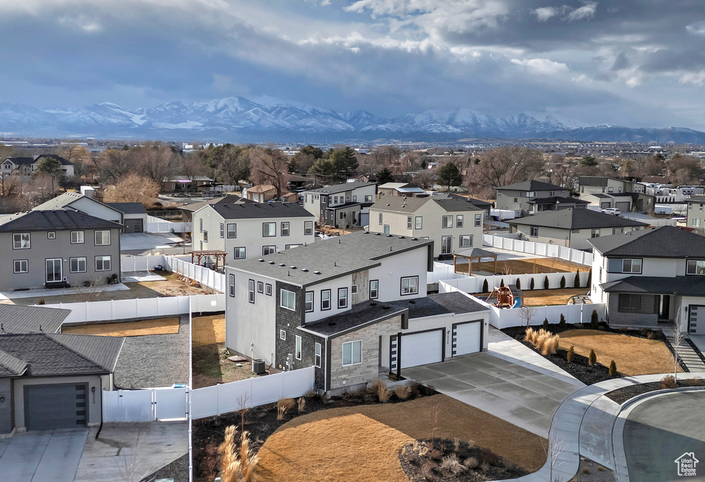 Birds eye view of property with a residential view and a mountain view