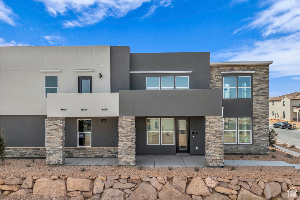 View of front facade featuring stucco siding