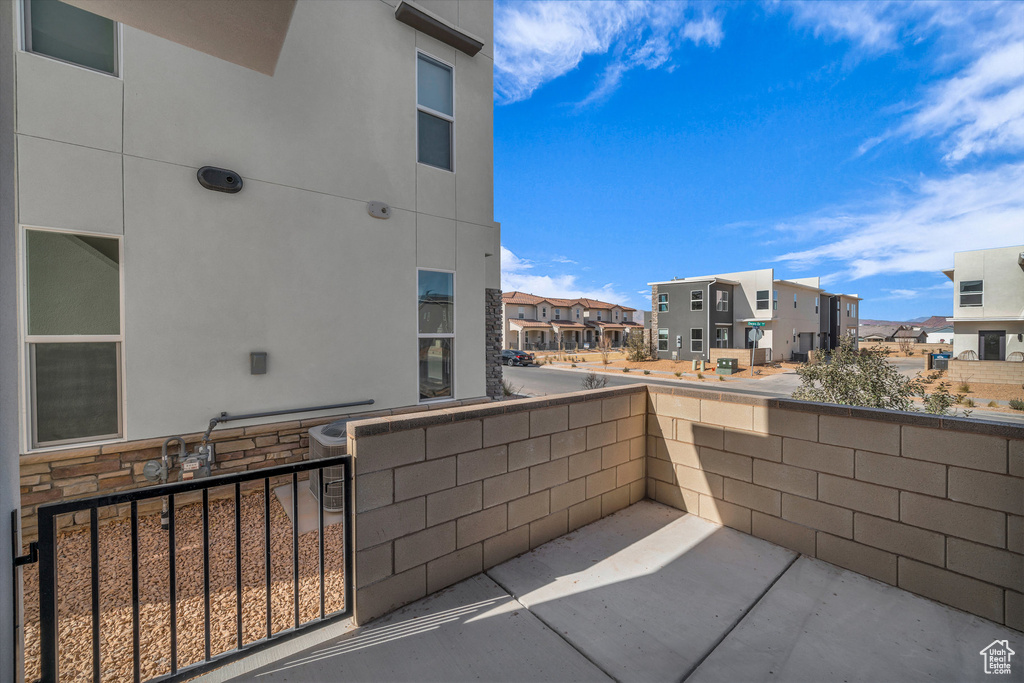 View of patio featuring a balcony and a residential view