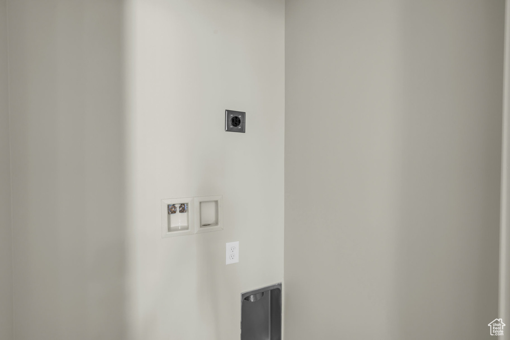 Laundry room featuring laundry area, washer hookup, and hookup for an electric dryer