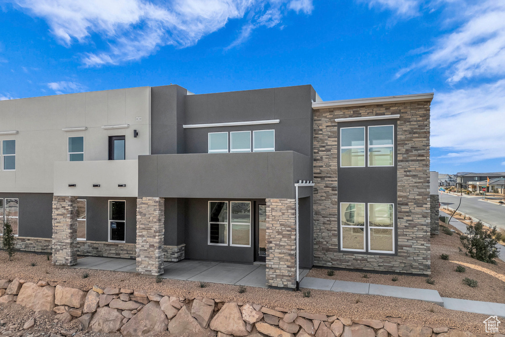 View of front of property featuring stucco siding