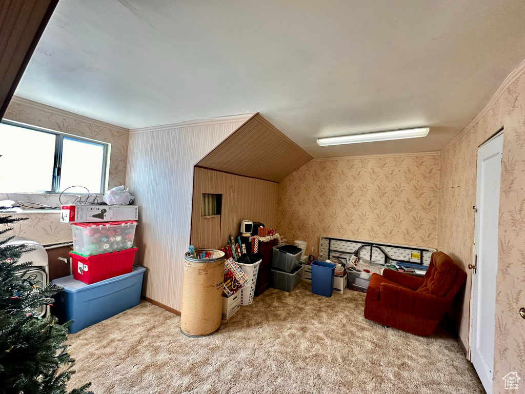 Bonus room featuring carpet flooring and wallpapered walls
