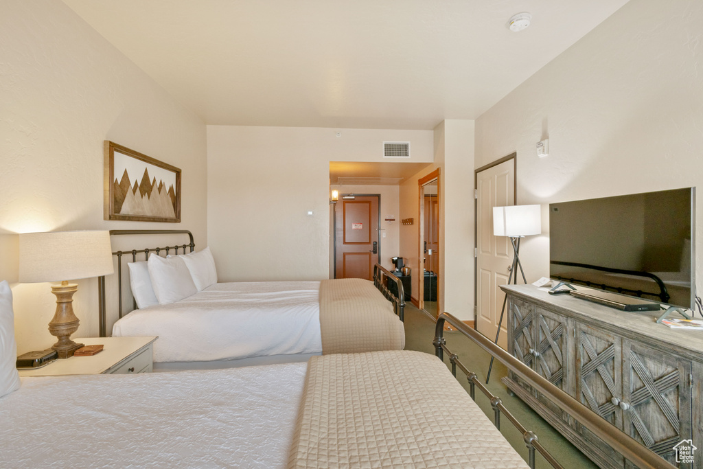 Bedroom featuring visible vents