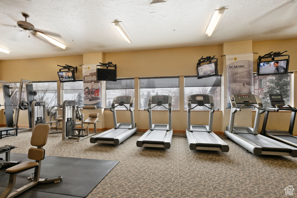 Workout area featuring a textured ceiling