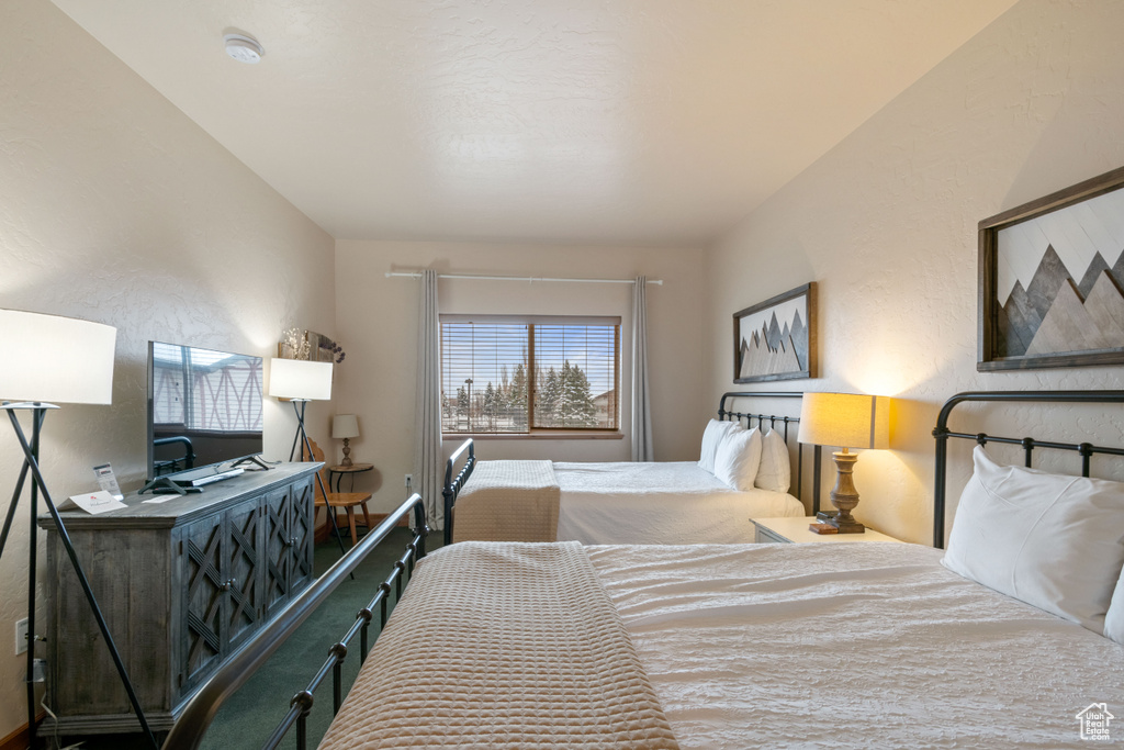 Bedroom featuring a textured wall